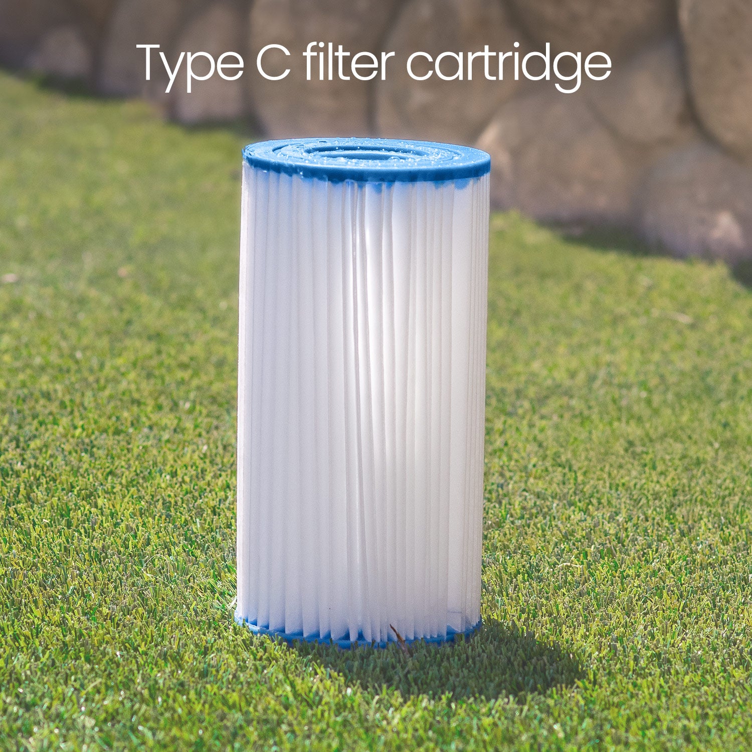 Filter cartridge with blue top on grass