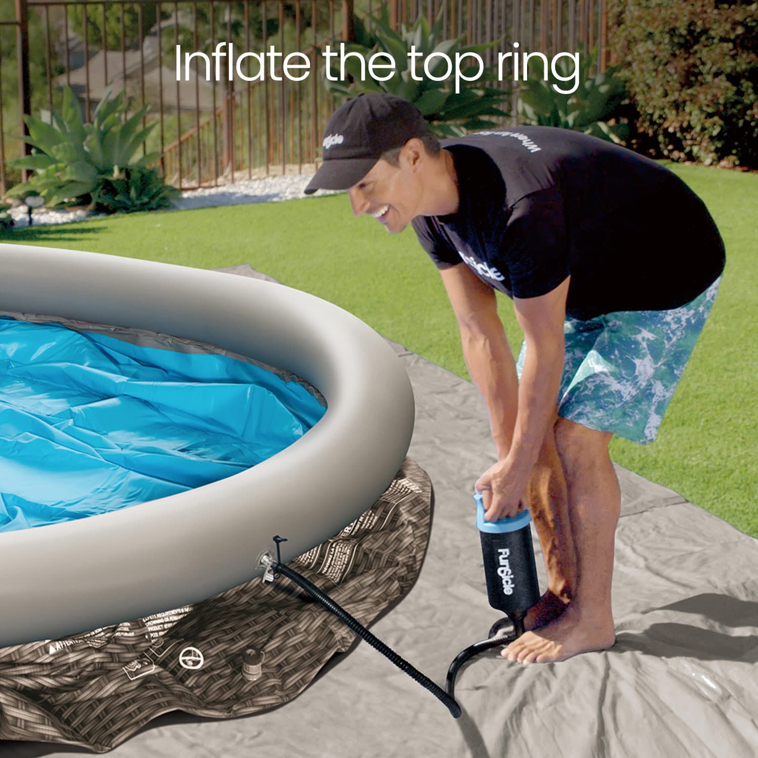 Person inflating an inflatable pool with a pump outdoors.