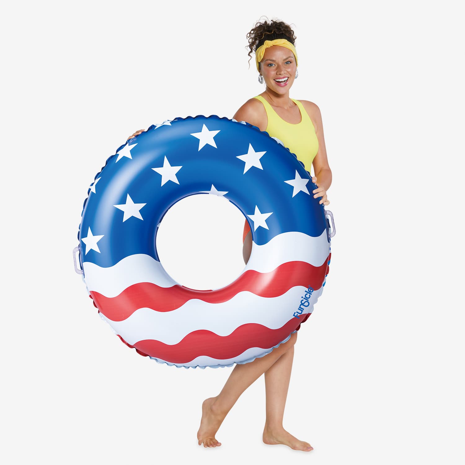 Woman holding a large American flag inflatable ring on a white background