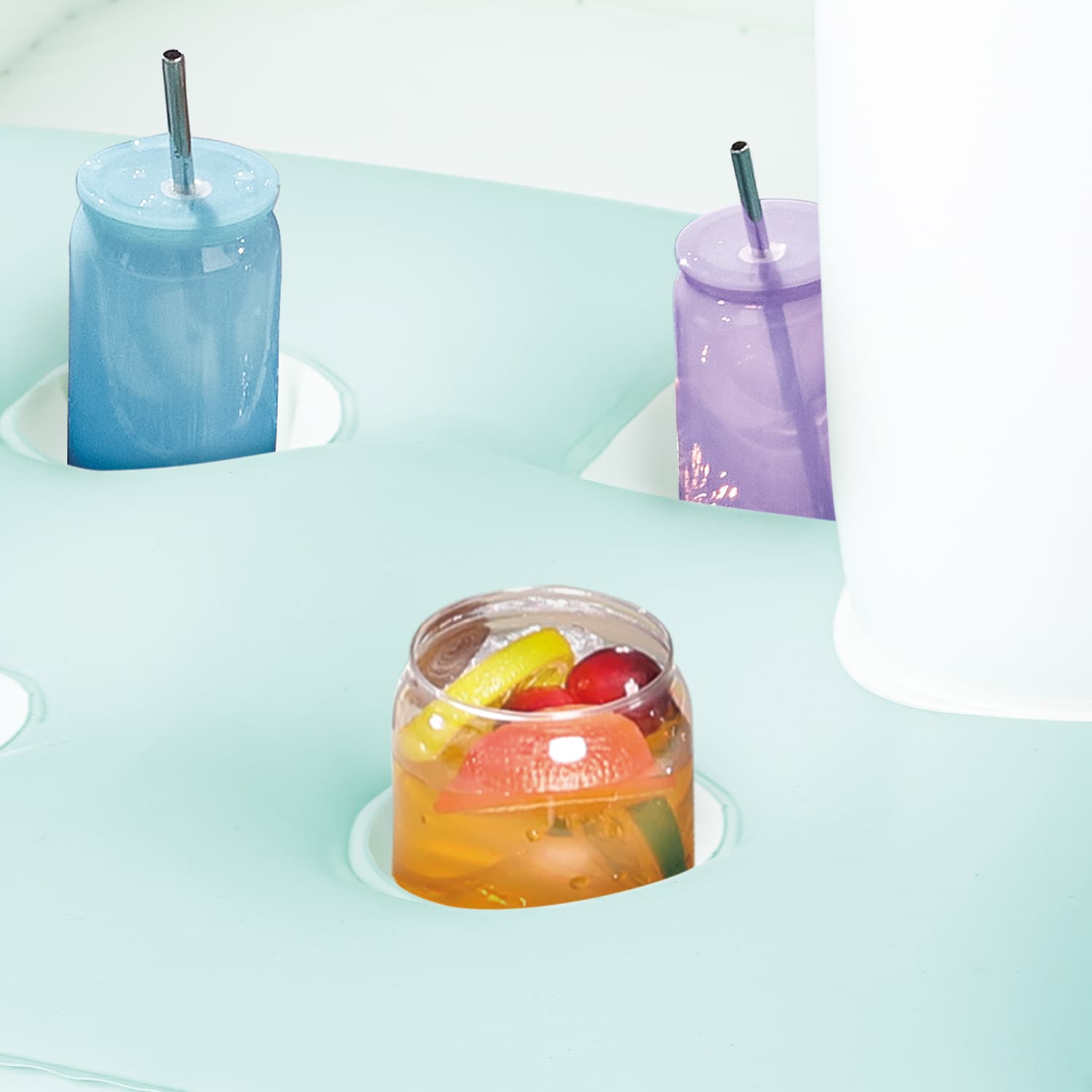 Close up of inflatable drink holders with colorful drinks in there