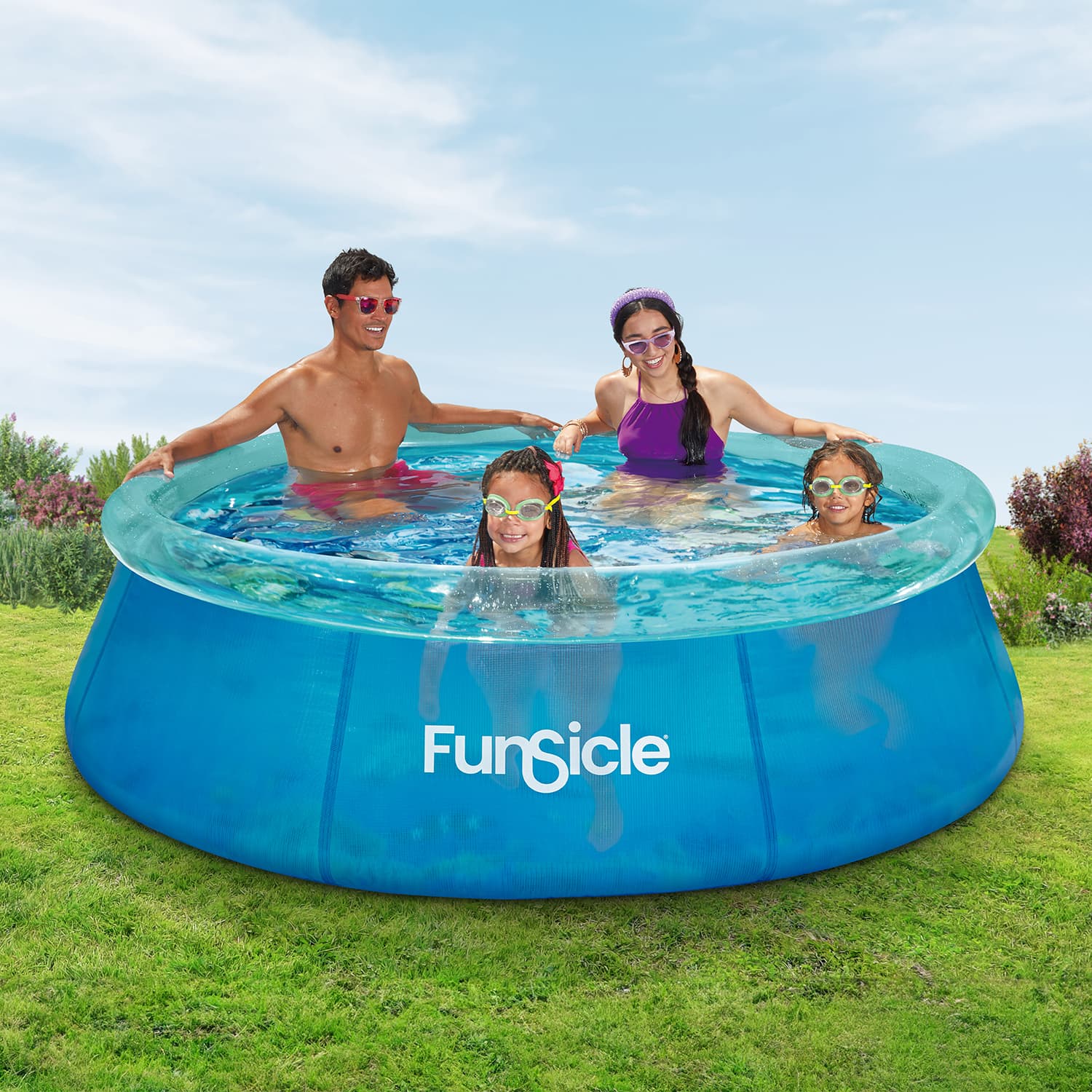 Family enjoying a Funsicle inflatable pool on a sunny day.