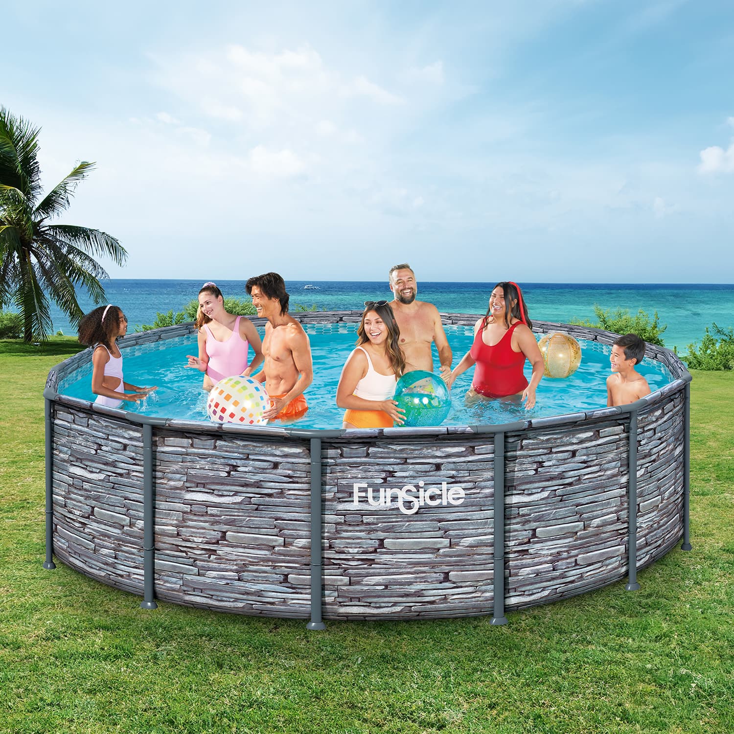 Family enjoying a pool day with a Funsicle pool in a grassy area by the ocean.